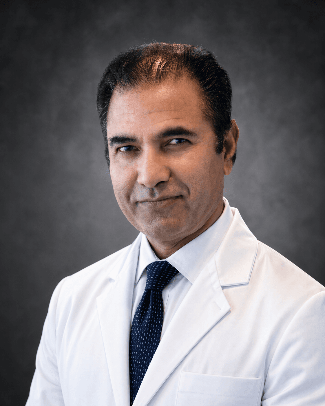Dr. Taj Khan
